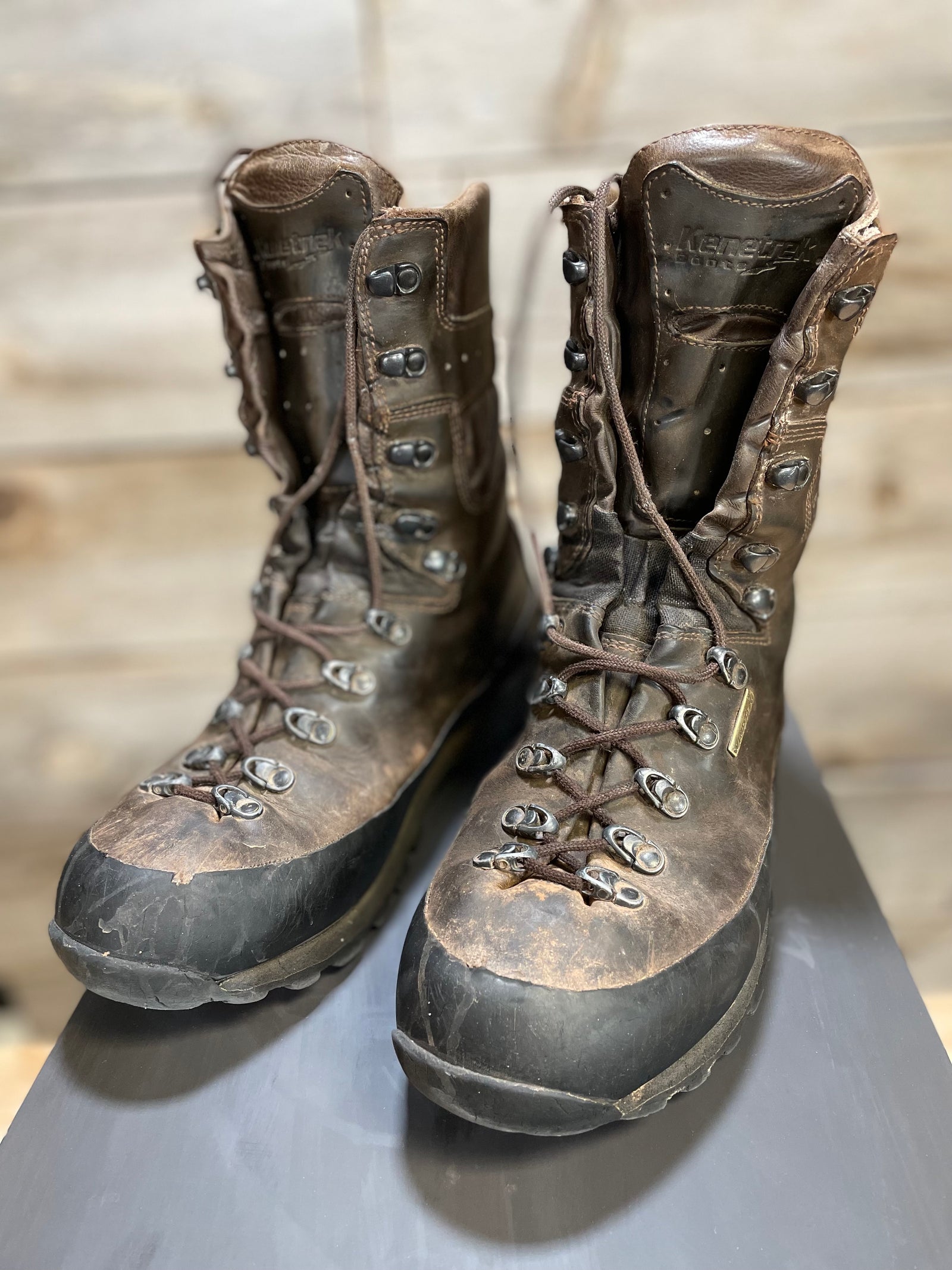 A pair of heavily used and worn Kenetrek Mountain Extreme Boots.